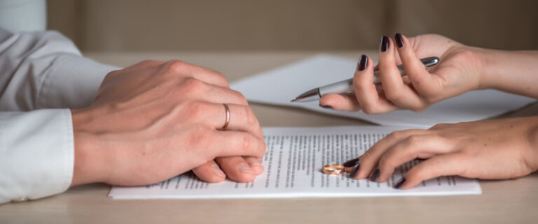 Couple signing documents