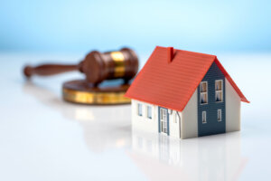 miniature house and legal gavel