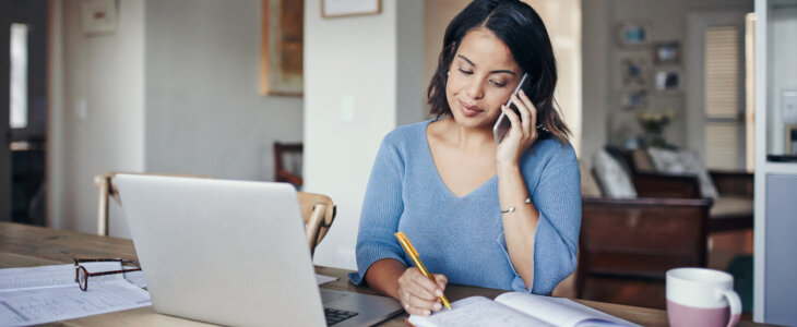 Female sitting at a table running a home business